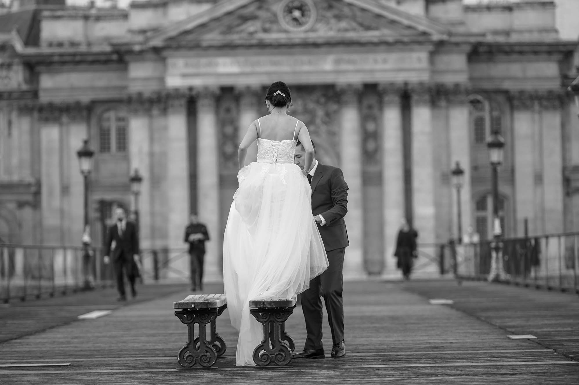 A bride and groom sharing a quiet moment at the Palais Royal